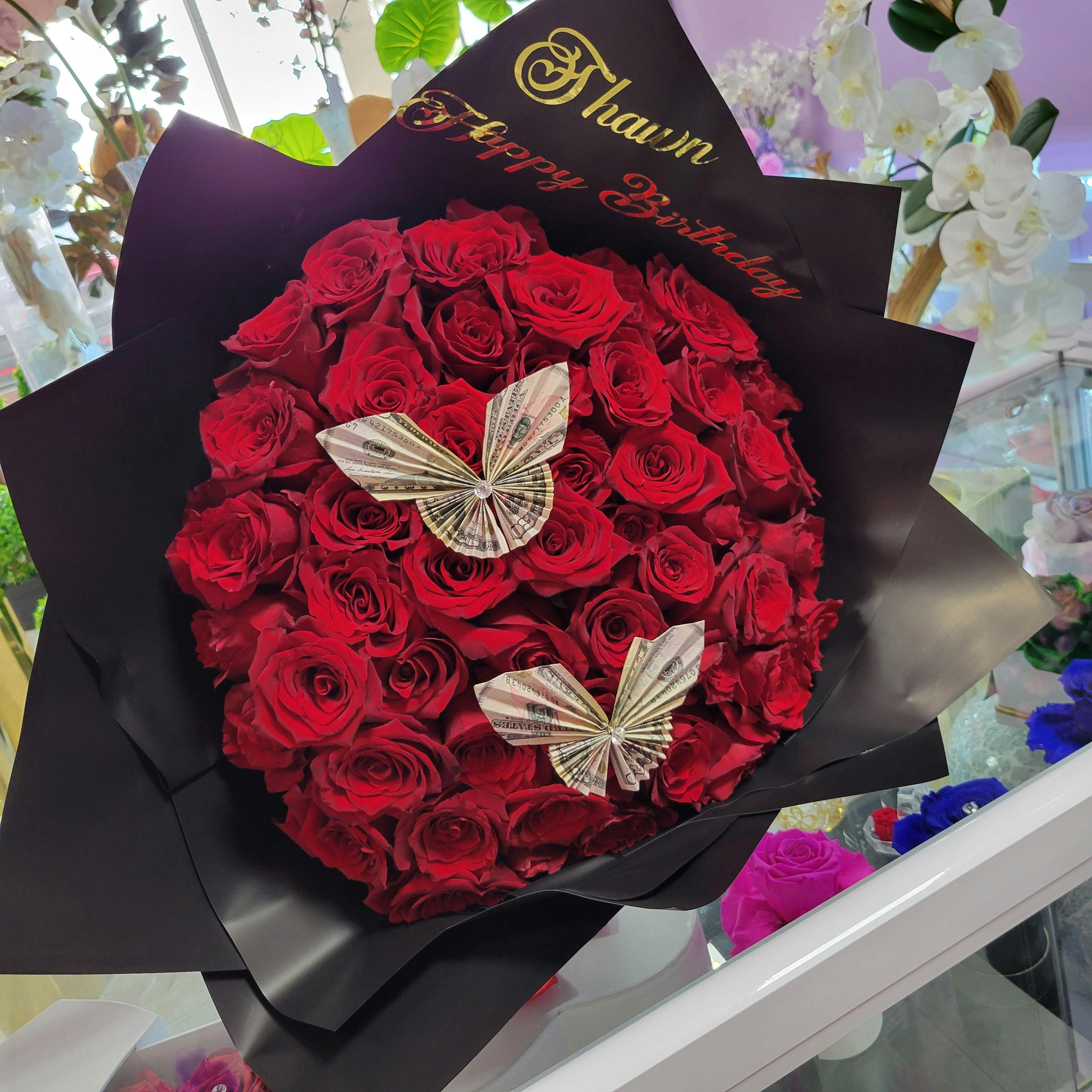 Bouquet of Roses & butterflies from real money .